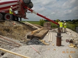 Filling the piles with concrete after rebar has been set